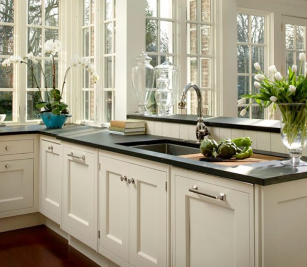 Photo of a beige kitchen with dark worktop on Craiyon