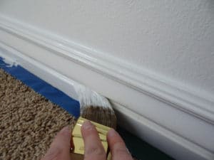 painting-trim-with-paint-brush