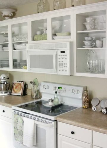 open shelving around microwave kitchen cabinets