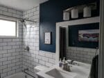 bathroom with tile on walls