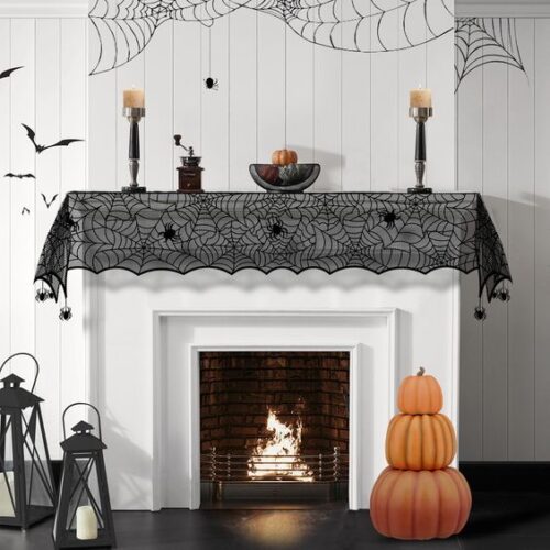 halloween mantel with spiderweb fabric