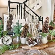 pinecone and wood birch centerpiece on kitchen table