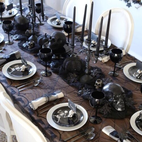 dark tablecloth with halloween decorations