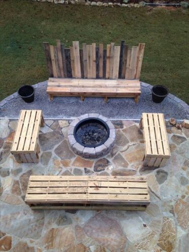 DIY pallet bench and table in homeowner backyard