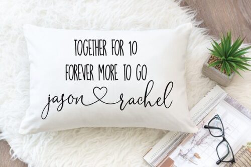 throw pillow on bed with personal names